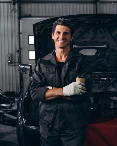 waist-up-portrait-view-of-the-auto-mechanic-standi-2024-10-20-09-59-41-utc.jpg